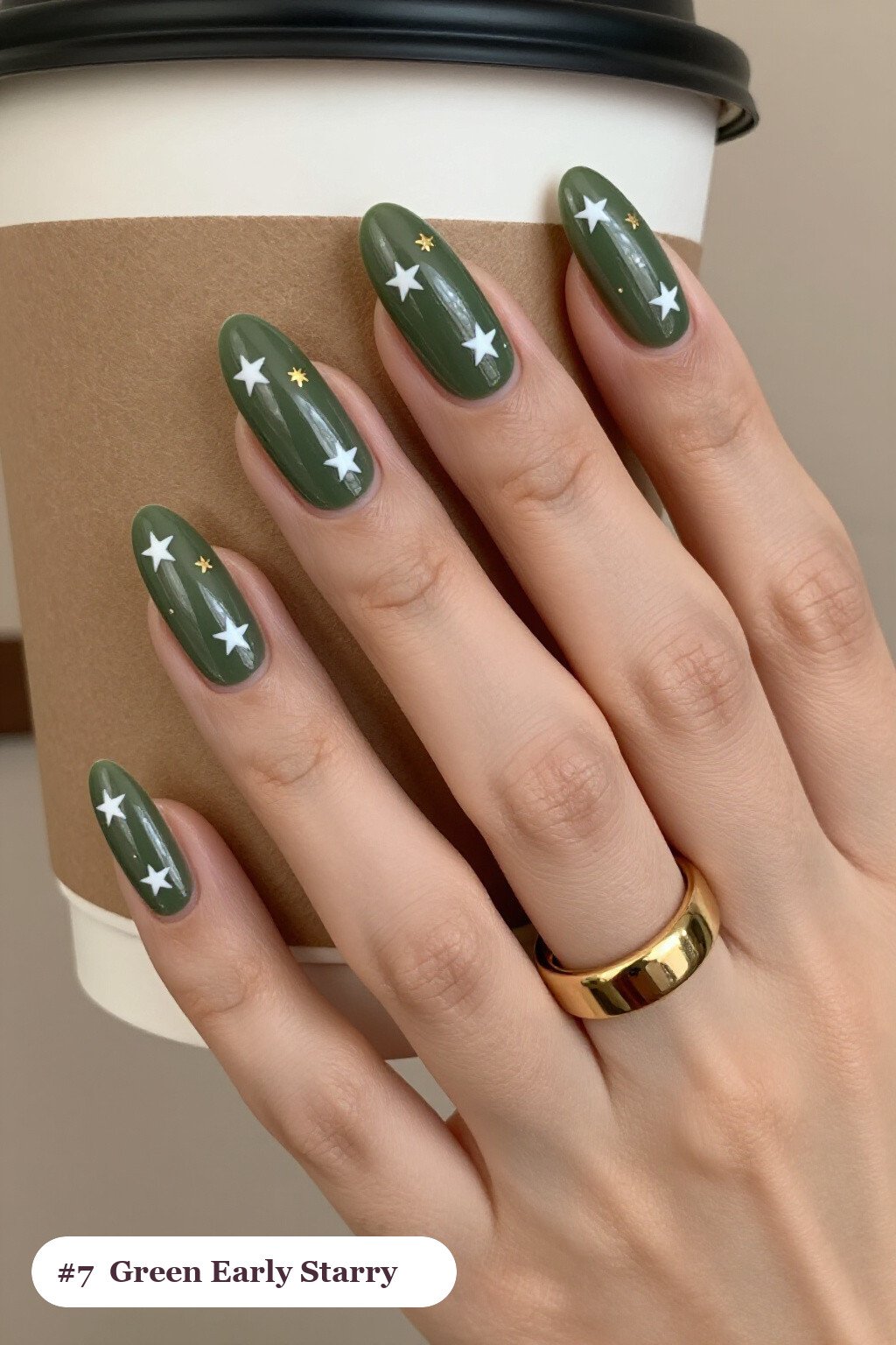 Long ballerina olive green early nails with white and gold stars and sparkles painted on every nail, perfect for fall - early fall nail designs