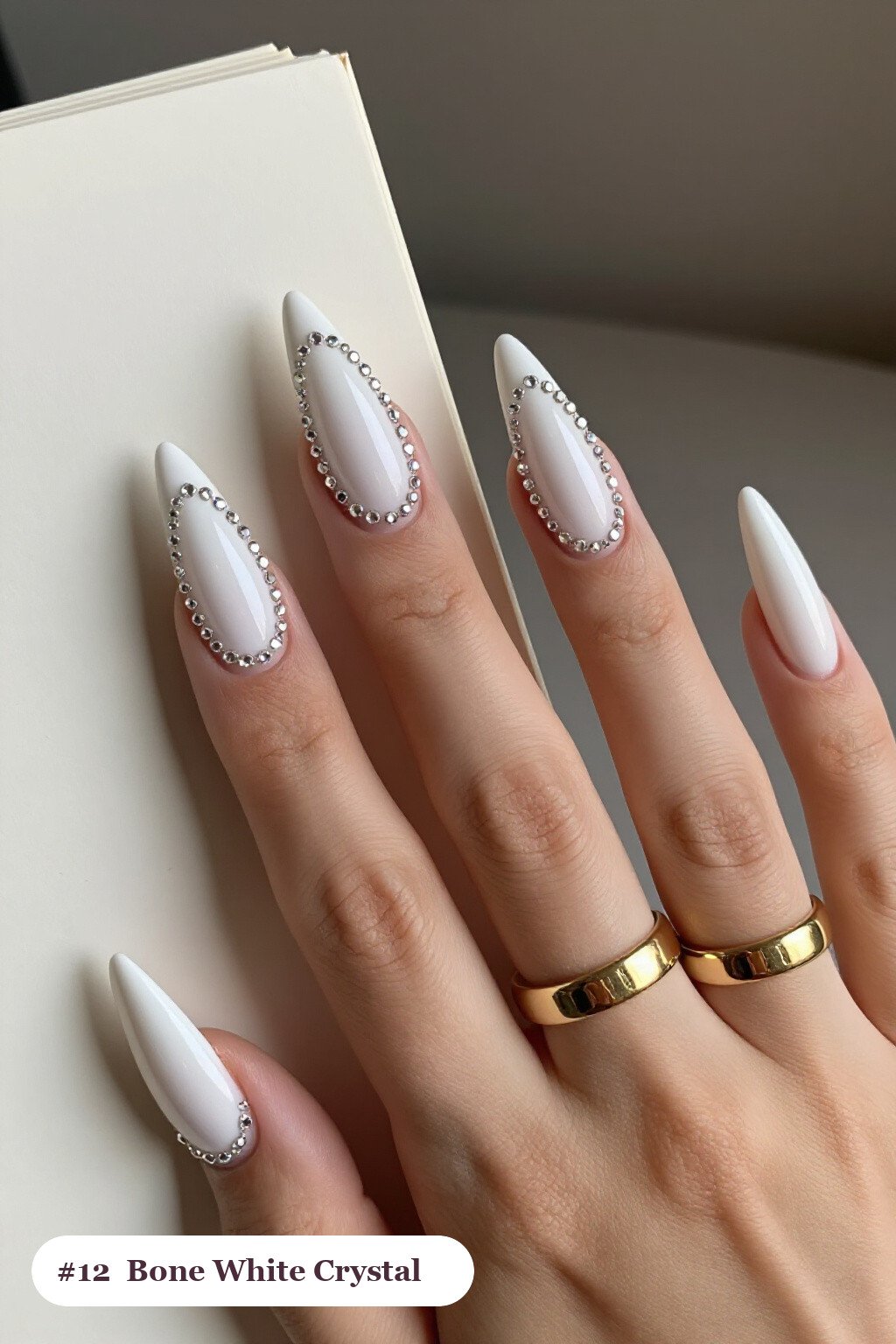 Bone‑White Stiletto Nails Lined with Rows of Crystal Rhinestones - easy halloween nail ideas