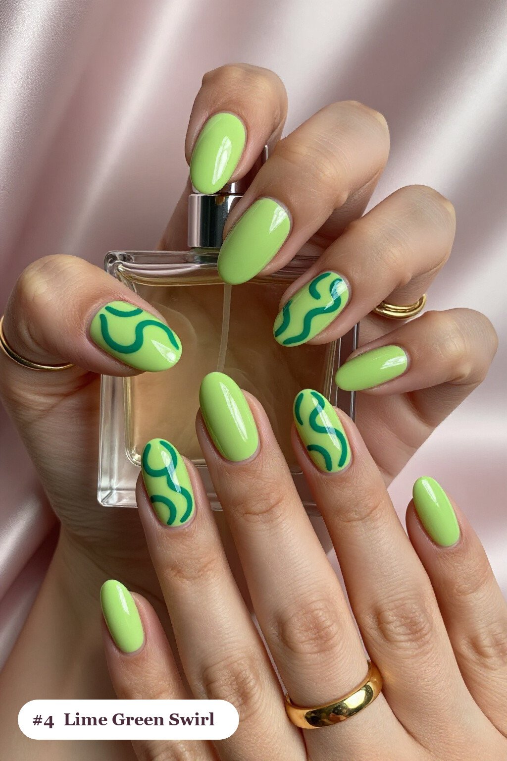 Lime‑Green Oval Nails Hand‑Painted with Bold Swirl Lines - easy halloween nail ideas