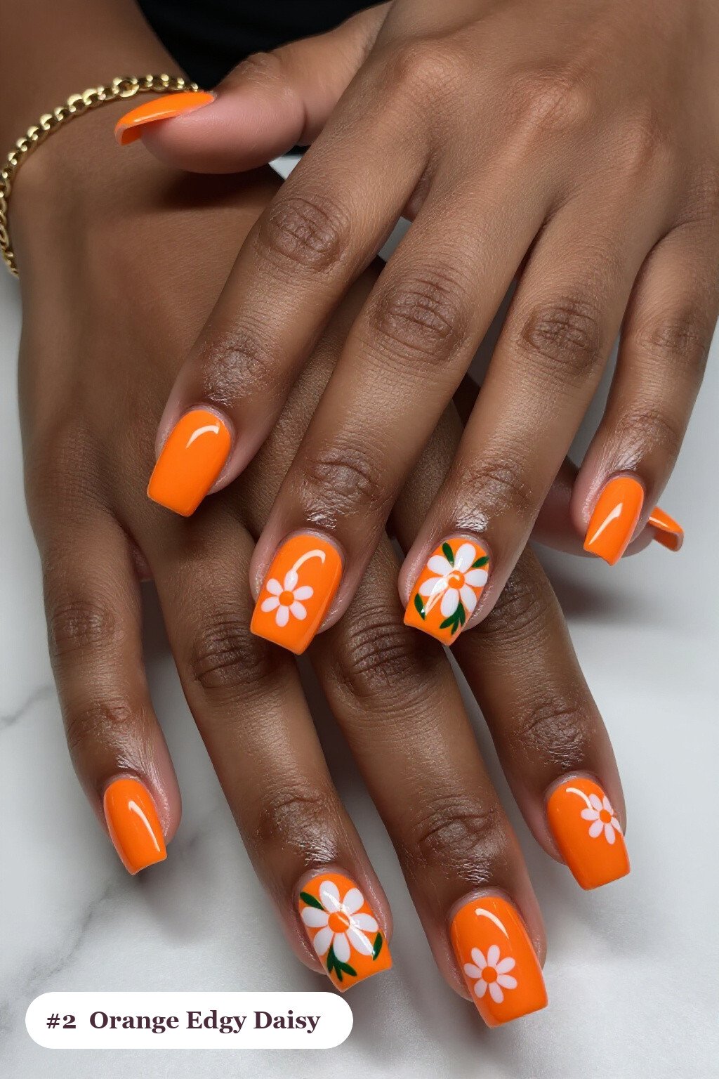Short Square Orange Nails Decorated with Hand‑Painted Daisies and Green Leaves - edgy halloween nail ideas