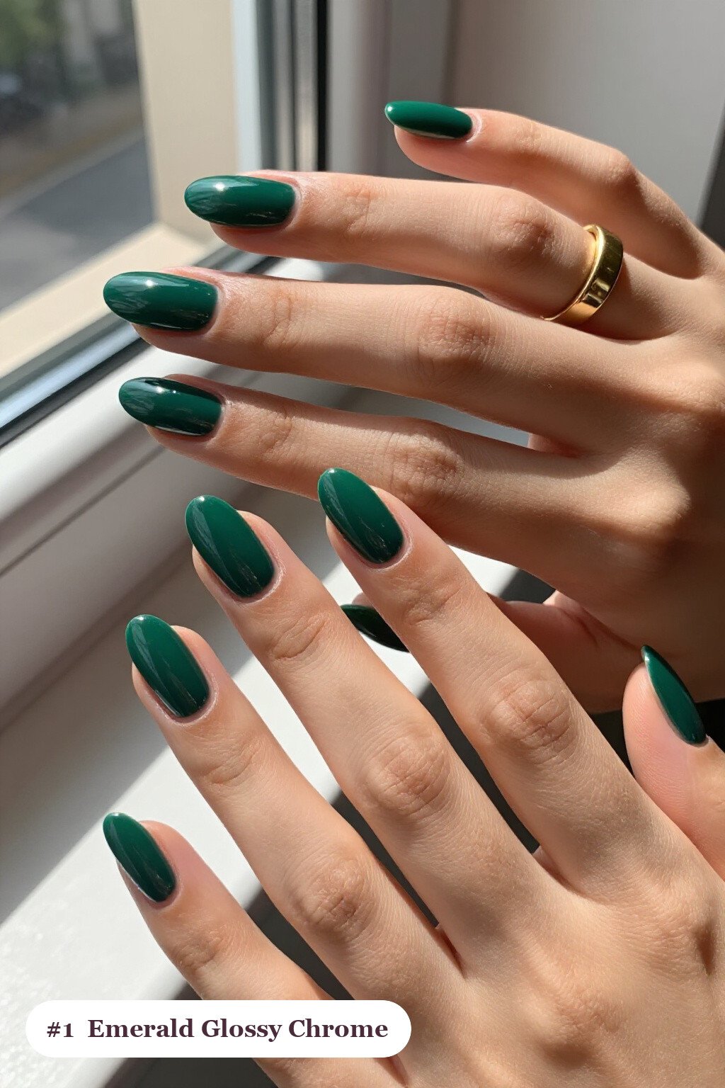 Medium almond emerald chrome nails with a liquid chrome mirror finish clearly visible on every nail, glossy and flawless - emerald chrome almond nails