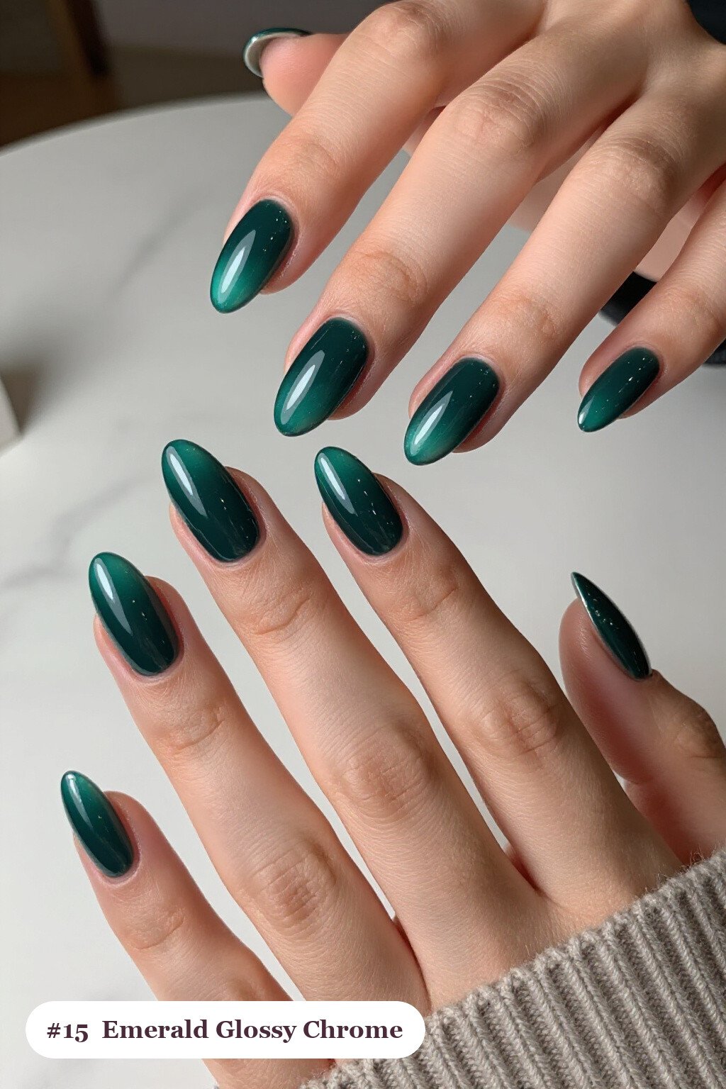 Medium almond emerald chrome nails with a liquid chrome mirror finish clearly visible on every nail, styled with a flawless mirror-glossy full-colour finish, with silver details - emerald chrome almond nails