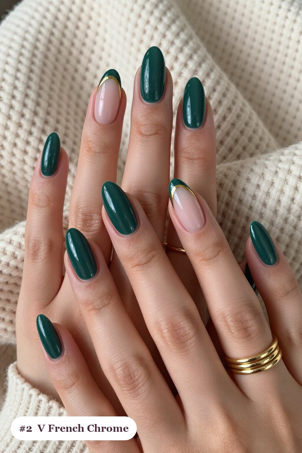 Medium almond emerald chrome nails with a liquid chrome mirror finish clearly visible on every nail, styled with deep V-shaped french tips in a bold contrasting colour, with gold details - emerald chrome almond nails