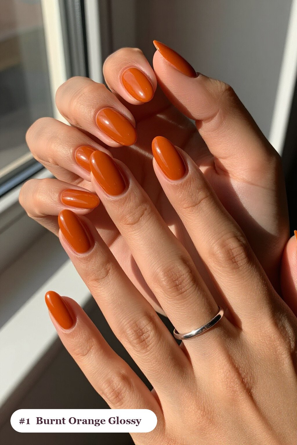 Medium almond burnt orange nails in a flawless mirror-glossy full-colour finish, perfect for fall - fall almond nails designs