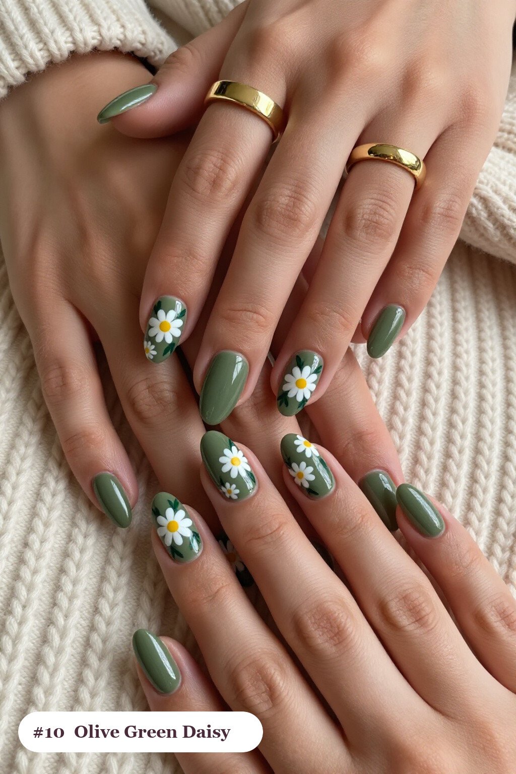Medium almond olive green nails with hand-painted daisies and green leaves across every nail, perfect for fall - fall almond nails designs