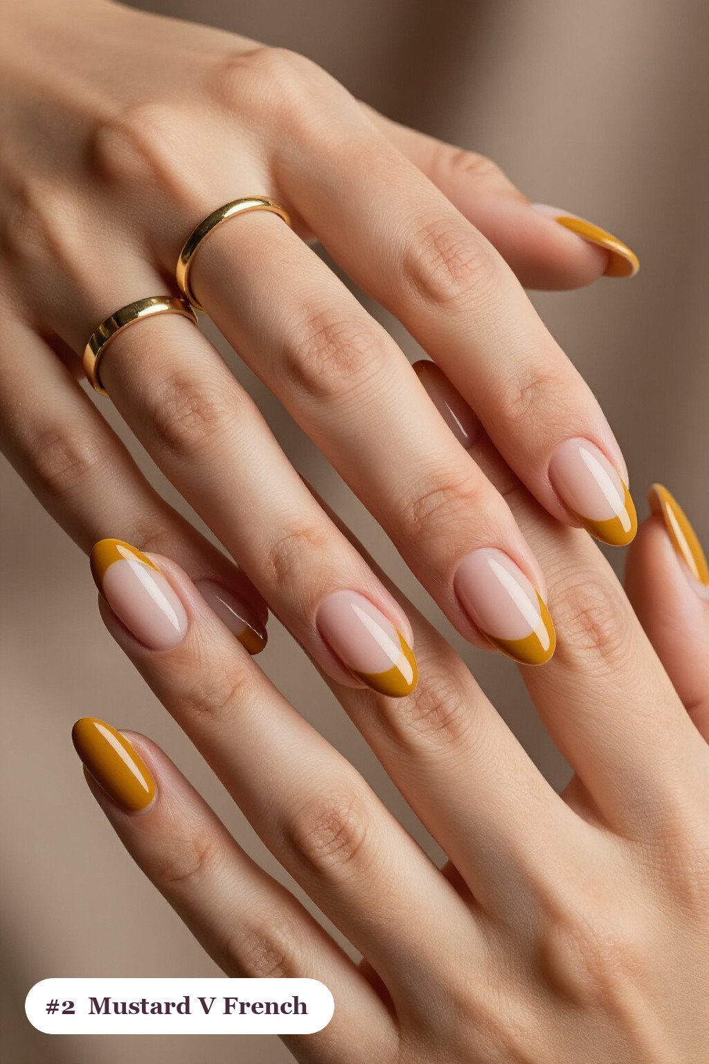 Medium almond mustard nails with deep V-shaped french tips in a bold contrasting colour, perfect for fall - fall almond nails designs