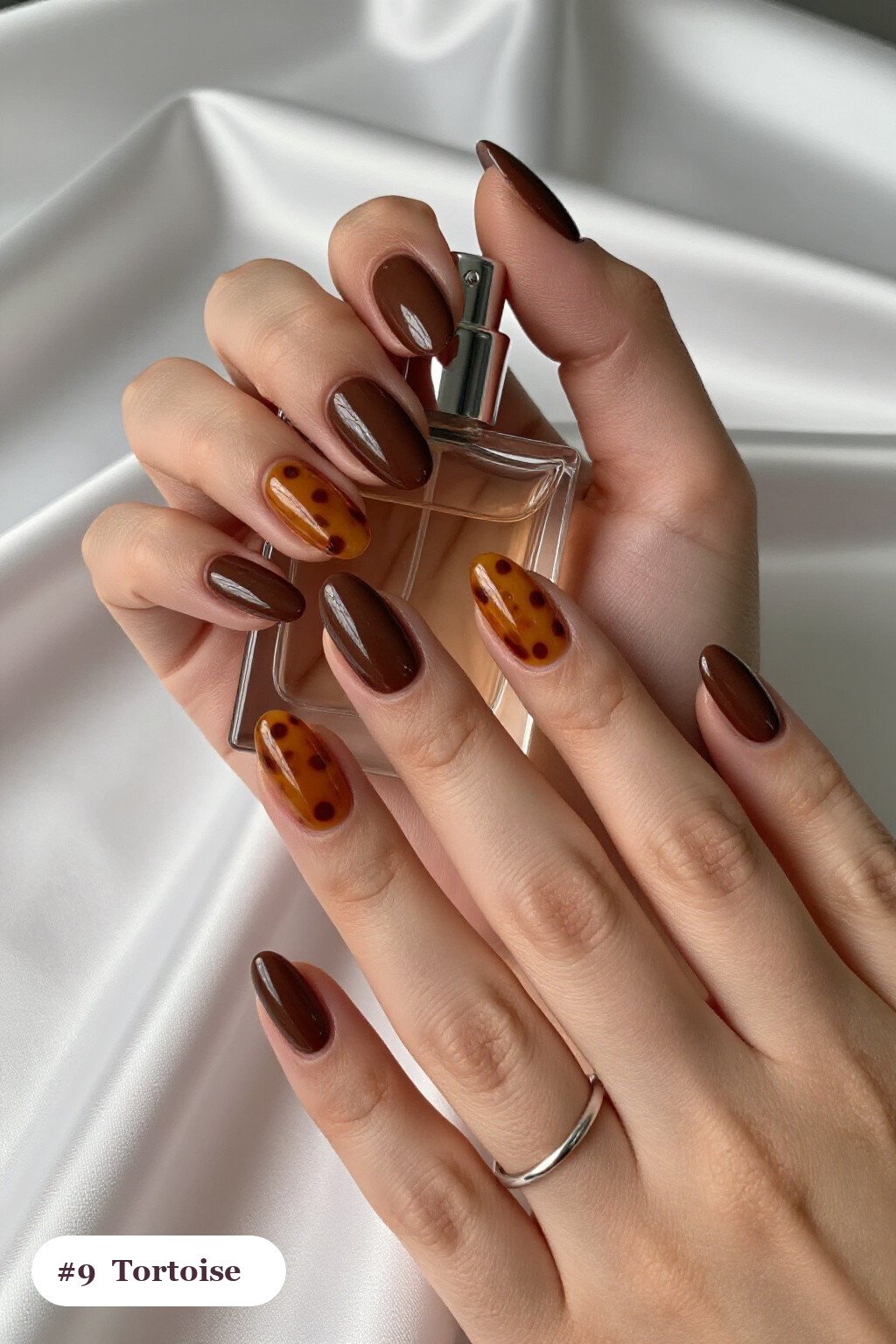 Medium almond chocolate brown nails with glossy amber tortoiseshell on two accent nails, perfect for fall - fall almond nails designs