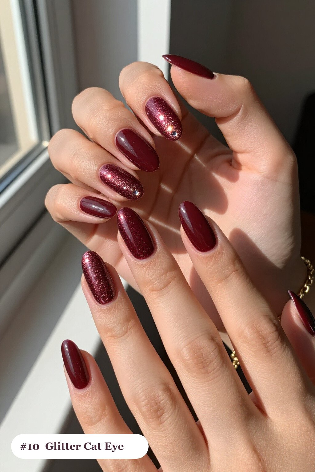 Medium almond burgundy cateye nails with a glowing magnetic cat eye shimmer band running down the centre of each nail like a gemstone clearly visible on every nail, styled with a sparkling glitter gradient rising from the cuticle, perfect for fall - fall cateye nails Medium almond burgundy cateye nails with a glowing magnetic cat eye shimmer band running down the centre of each nail like a gemstone clearly visible on every nail, styled with a sparkling glitter gradient rising from the cuticle, perfect for fall - fall cateye nails