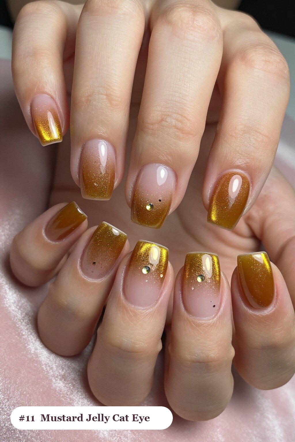 Medium square mustard cateye nails with a glowing magnetic cat eye shimmer band running down the centre of each nail like a gemstone clearly visible on every nail, styled with a see-through jelly finish with encapsulated glitter, perfect for fall - fall cateye nails Medium square mustard cateye nails with a glowing magnetic cat eye shimmer band running down the centre of each nail like a gemstone clearly visible on every nail, styled with a see-through jelly finish with encapsulated glitter, perfect for fall - fall cateye nails