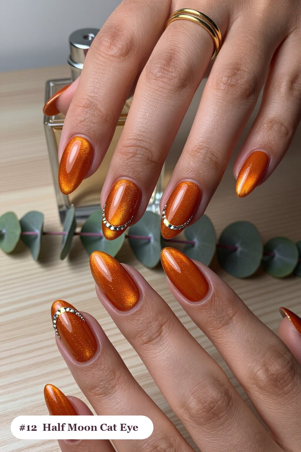 Long ballerina burnt orange cateye nails with a glowing magnetic cat eye shimmer band running down the centre of each nail like a gemstone clearly visible on every nail, styled with a half-moon design with a glitter crescent at the cuticle, perfect for fall - fall cateye nails Long ballerina burnt orange cateye nails with a glowing magnetic cat eye shimmer band running down the centre of each nail like a gemstone clearly visible on every nail, styled with a half-moon design with a glitter crescent at the cuticle, perfect for fall - fall cateye nails
