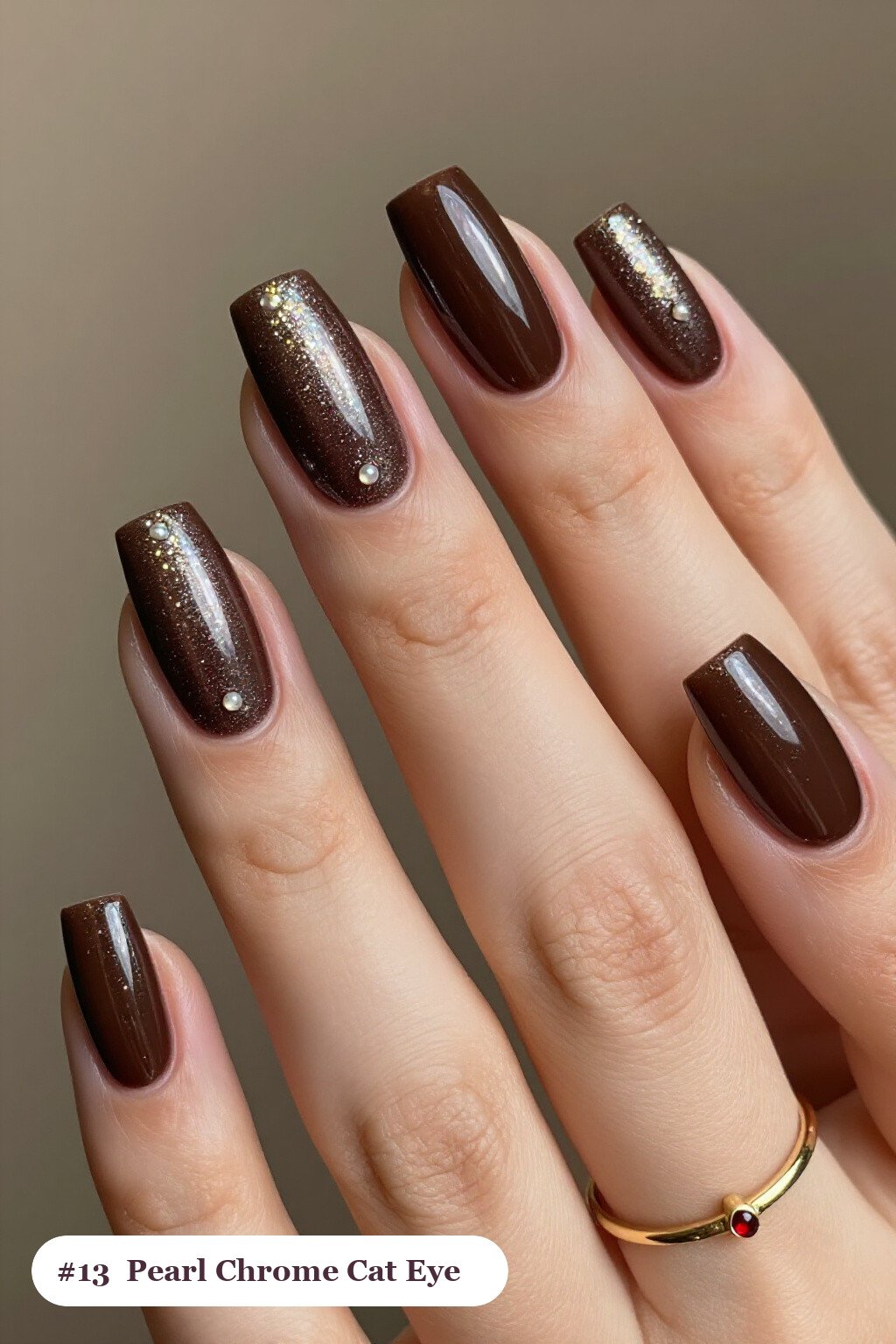 Long square chocolate brown cateye nails with a glowing magnetic cat eye shimmer band running down the centre of each nail like a gemstone clearly visible on every nail, styled with glazed pearl chrome over the colour for an iridescent sheen, perfect for fall - fall cateye nails Long square chocolate brown cateye nails with a glowing magnetic cat eye shimmer band running down the centre of each nail like a gemstone clearly visible on every nail, styled with glazed pearl chrome over the colour for an iridescent sheen, perfect for fall - fall cateye nails