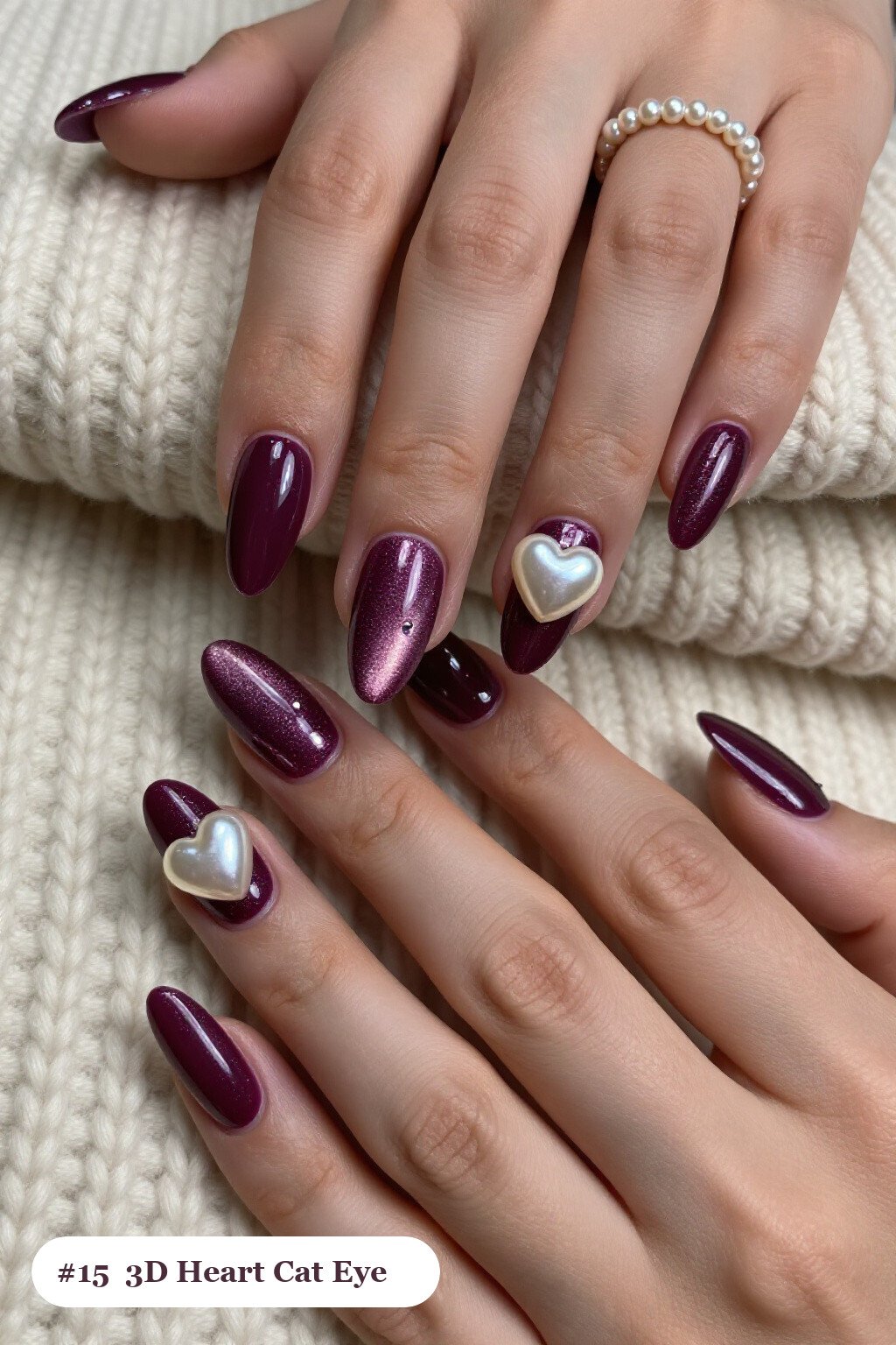 Medium coffin deep plum cateye nails with a glowing magnetic cat eye shimmer band running down the centre of each nail like a gemstone clearly visible on every nail, styled with chunky 3D gel hearts and pearls on three nails, perfect for fall - fall cateye nails Medium coffin deep plum cateye nails with a glowing magnetic cat eye shimmer band running down the centre of each nail like a gemstone clearly visible on every nail, styled with chunky 3D gel hearts and pearls on three nails, perfect for fall - fall cateye nails