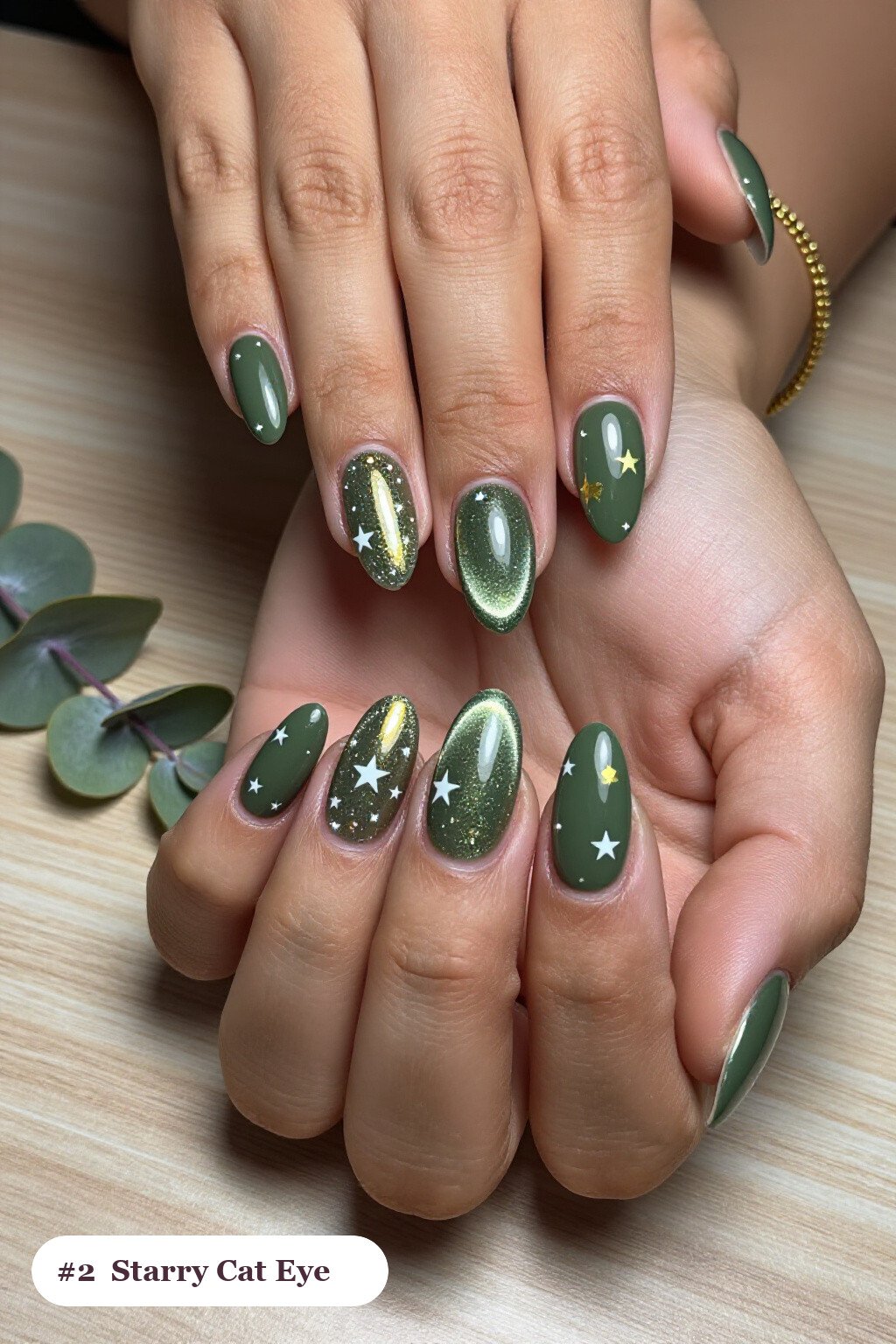 Long ballerina olive green cateye nails with a glowing magnetic cat eye shimmer band running down the centre of each nail like a gemstone clearly visible on every nail, styled with white and gold stars and sparkles painted on every nail, perfect for fall - fall cateye nails Long ballerina olive green cateye nails with a glowing magnetic cat eye shimmer band running down the centre of each nail like a gemstone clearly visible on every nail, styled with white and gold stars and sparkles painted on every nail, perfect for fall - fall cateye nails