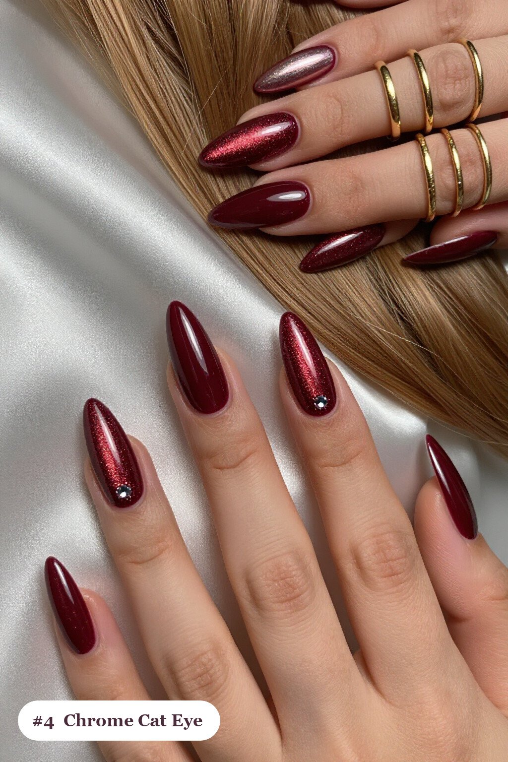 Long stiletto burgundy cateye nails with a glowing magnetic cat eye shimmer band running down the centre of each nail like a gemstone clearly visible on every nail, styled with a liquid chrome mirror finish and bright metallic highlights, perfect for fall - fall cateye nails Long stiletto burgundy cateye nails with a glowing magnetic cat eye shimmer band running down the centre of each nail like a gemstone clearly visible on every nail, styled with a liquid chrome mirror finish and bright metallic highlights, perfect for fall - fall cateye nails