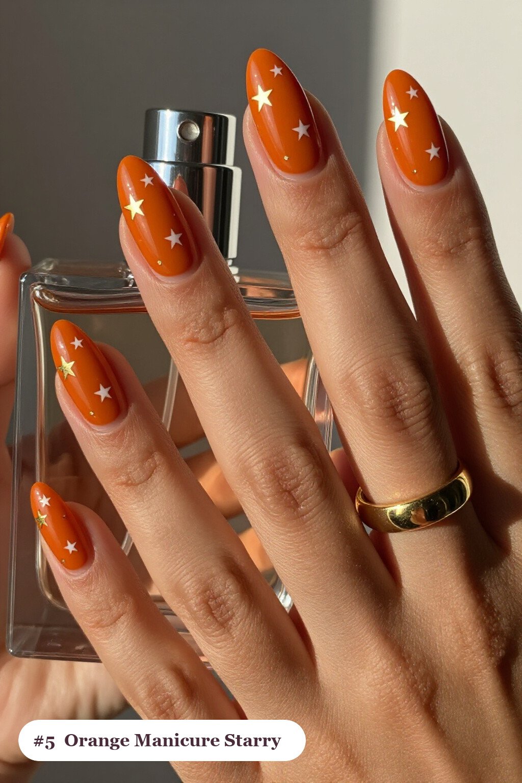Burnt Orange Medium Almond Nails with White & Gold Stars: How to Make It Last Longer - fall manicure ideas