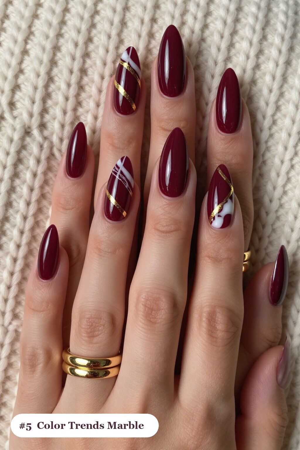 Long Stiletto Burgundy Nails with Bold Marble Veins in White and Gold - fall nail color trends