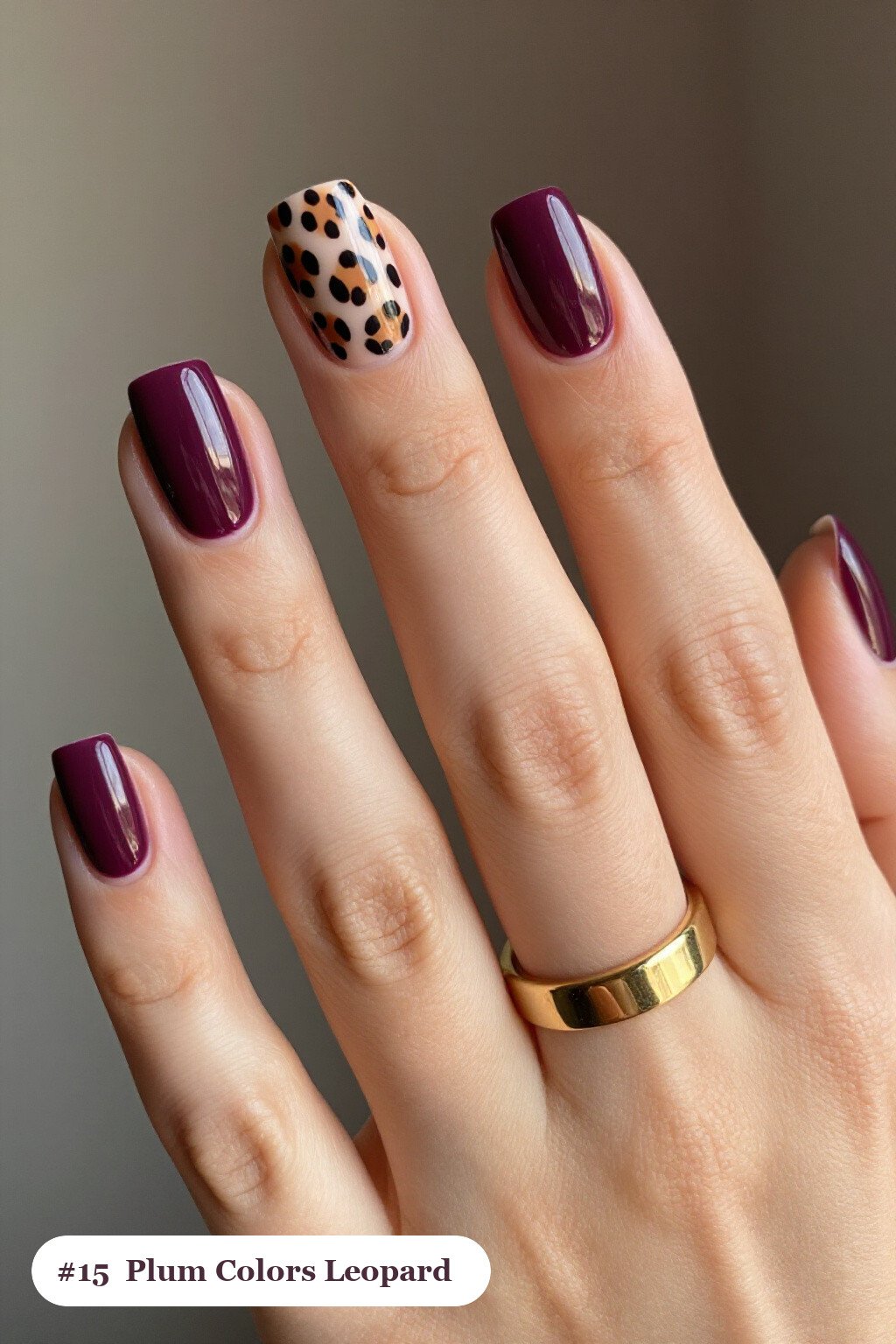 Short square deep plum colors nails with a leopard print pattern on two accent nails and solid colour on the rest, perfect for fall - fall nail colors