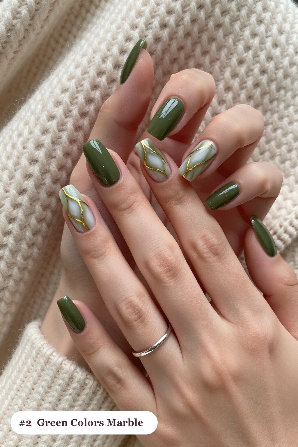 Long coffin olive green colors nails with bold marble veins in white and gold across every nail, perfect for fall - fall nail colors