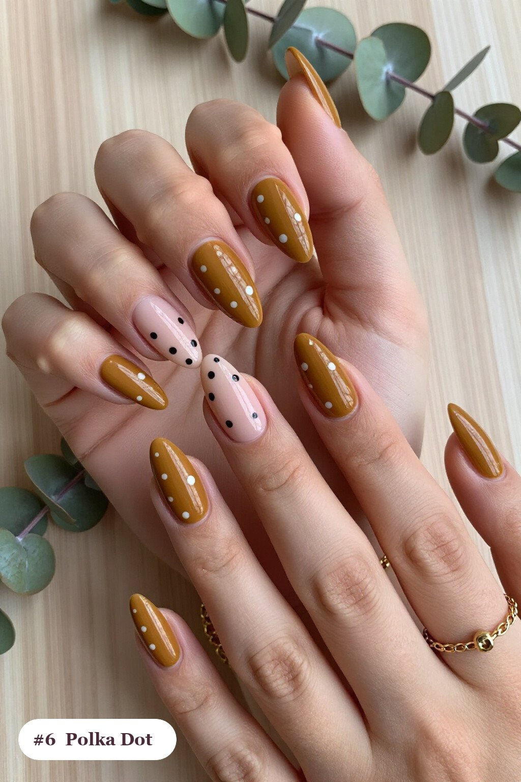 Long stiletto mustard colors nails with playful polka dots in two colours on alternating nails, perfect for fall - fall nail colors