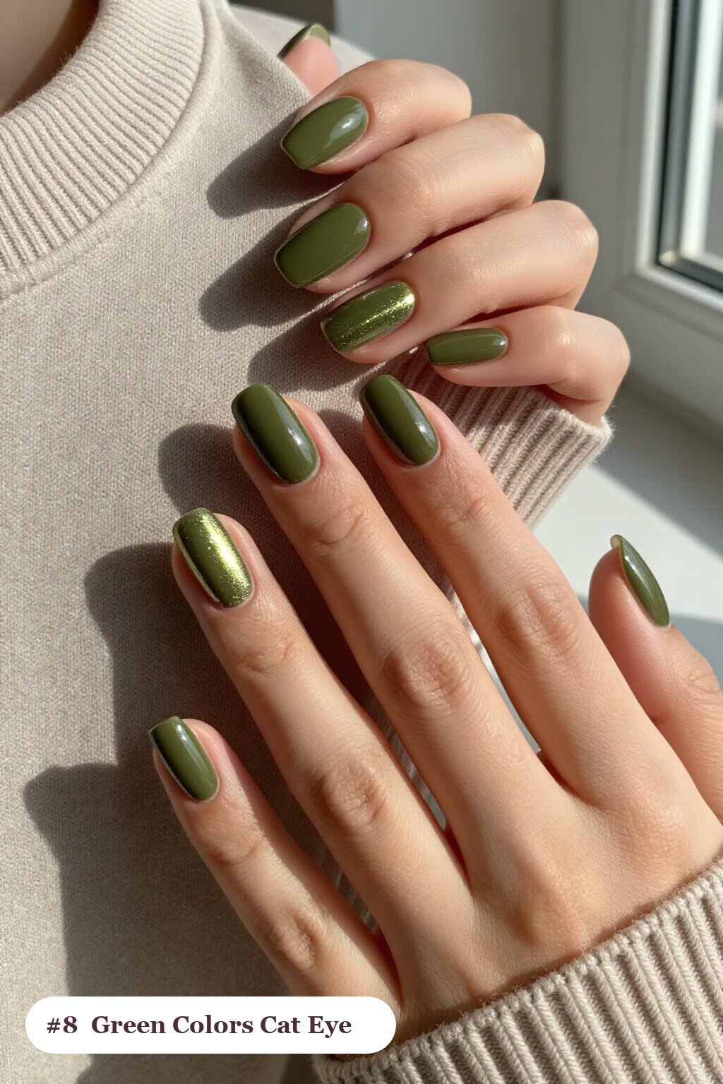Medium coffin olive green colors nails with a glowing shimmer band of light running down the centre of each nail like a gemstone, perfect for fall - fall nail colors