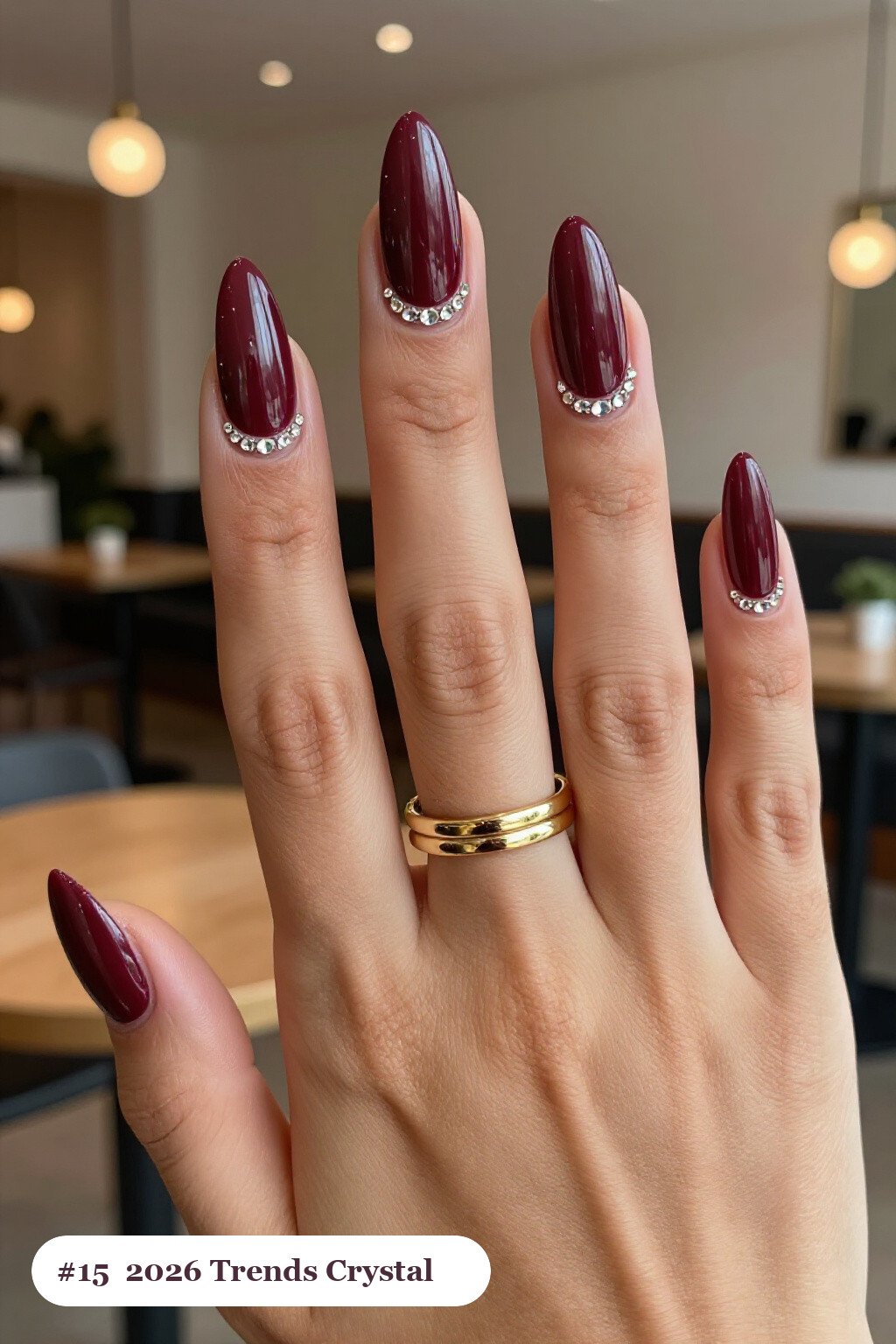 Burgundy Almond Nails with Rows of Sparkling Crystal Rhinestones Along the Cuticle - fall nails 2026 trends