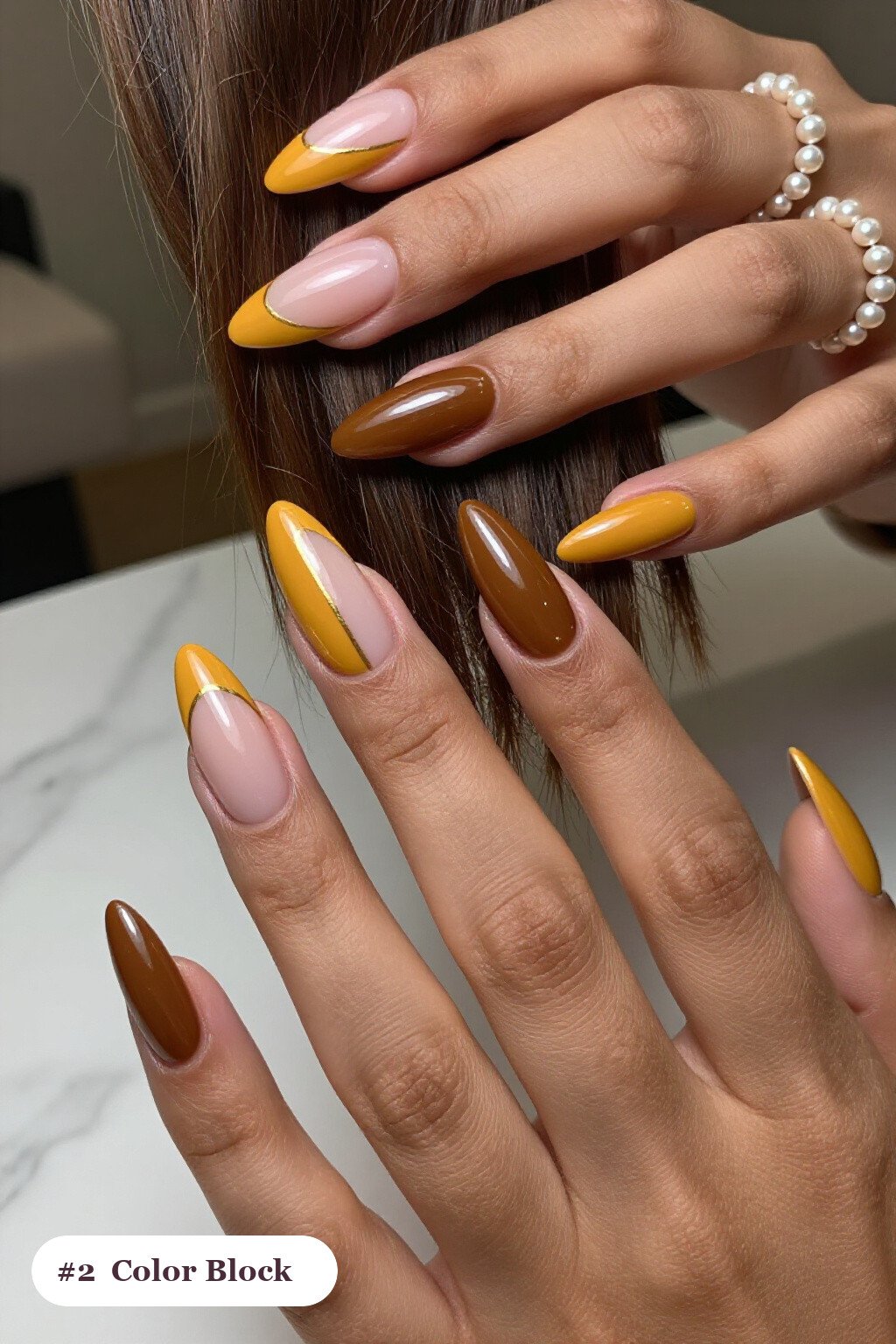 Mustard Stiletto Nails with Diagonal Color‑Block and Gold Line - fall nails 2026 trends