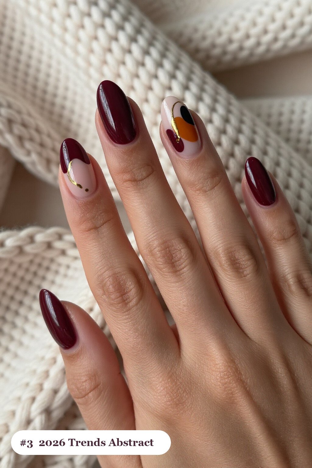 Burgundy Oval Nails Featuring Abstract Color Blobs, Gold Outlines & Dots - fall nails 2026 trends