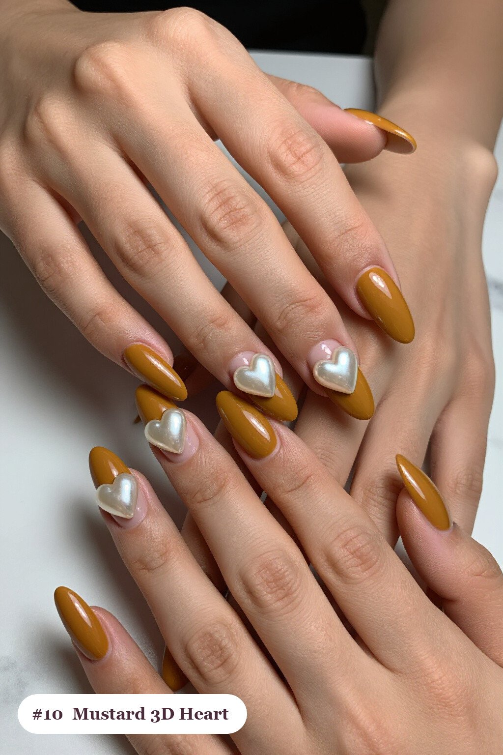 Long coffin mustard nails with chunky 3D gel hearts and pearls on three nails, perfect for fall - fall nails cute