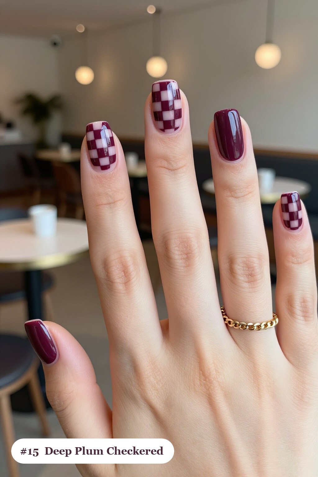 Medium square deep plum nails with a bold checkerboard pattern on two accent nails and solid colour on the rest, perfect for fall - fall nails cute