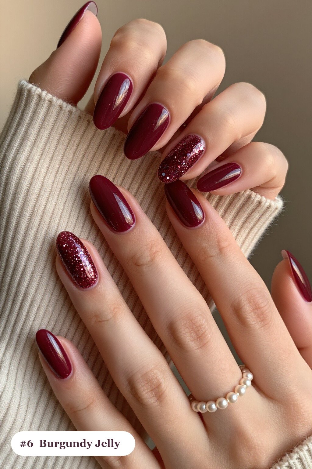Medium almond burgundy nails in a see-through jelly finish with encapsulated glitter, perfect for fall - fall nails cute