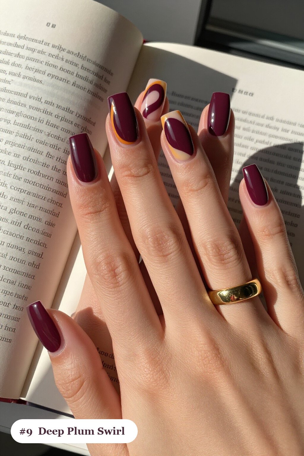 Long square deep plum nails with bold hand-painted swirl lines flowing across every nail in a contrasting colour, perfect for fall - fall nails cute