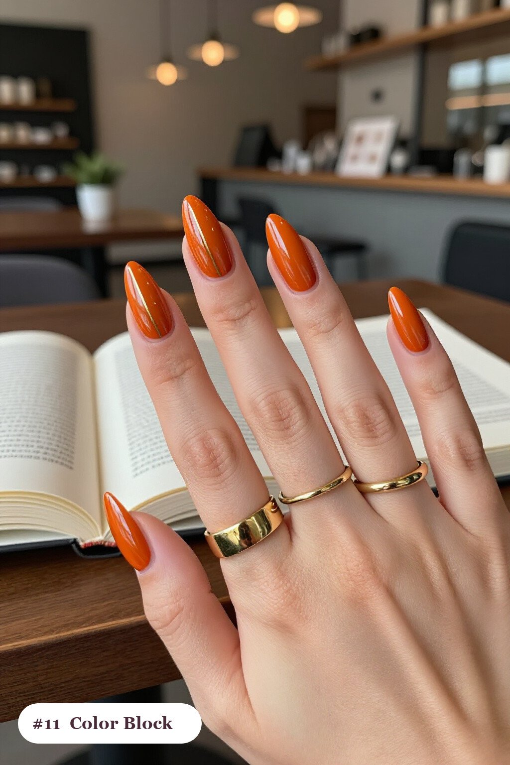Burnt Orange Long Stiletto Nails Split Diagonally with Thin Gold Line Color‑Block - fall nails leaves