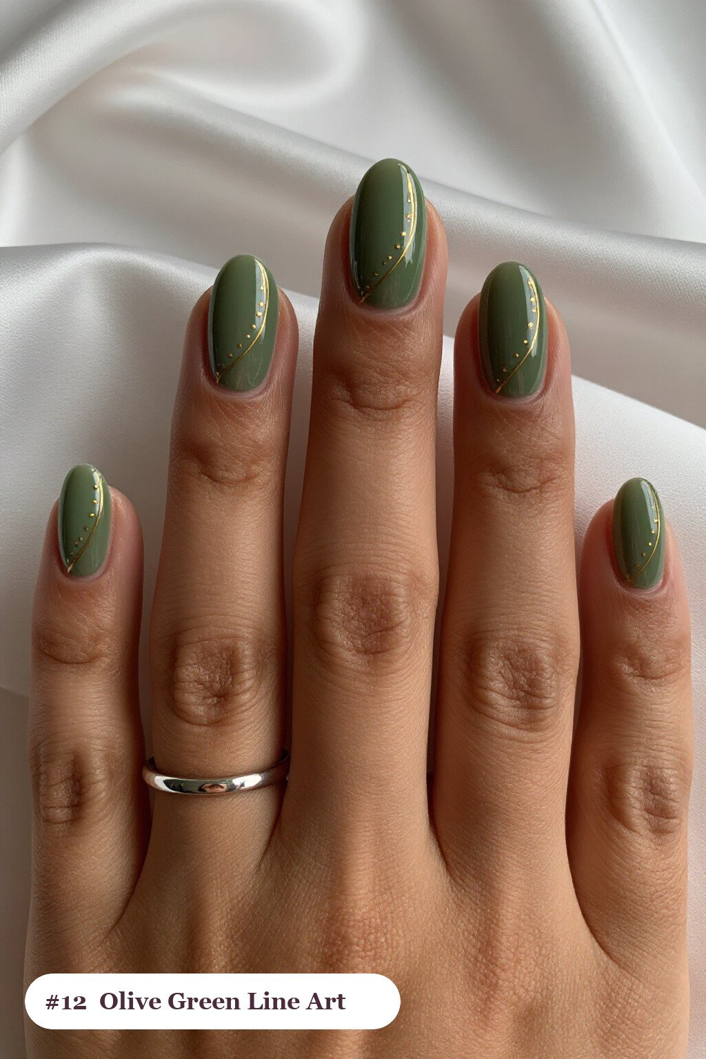 Short almond olive green nails with fine gold line art and tiny dots drawn across every nail, perfect for fall - fall nails short