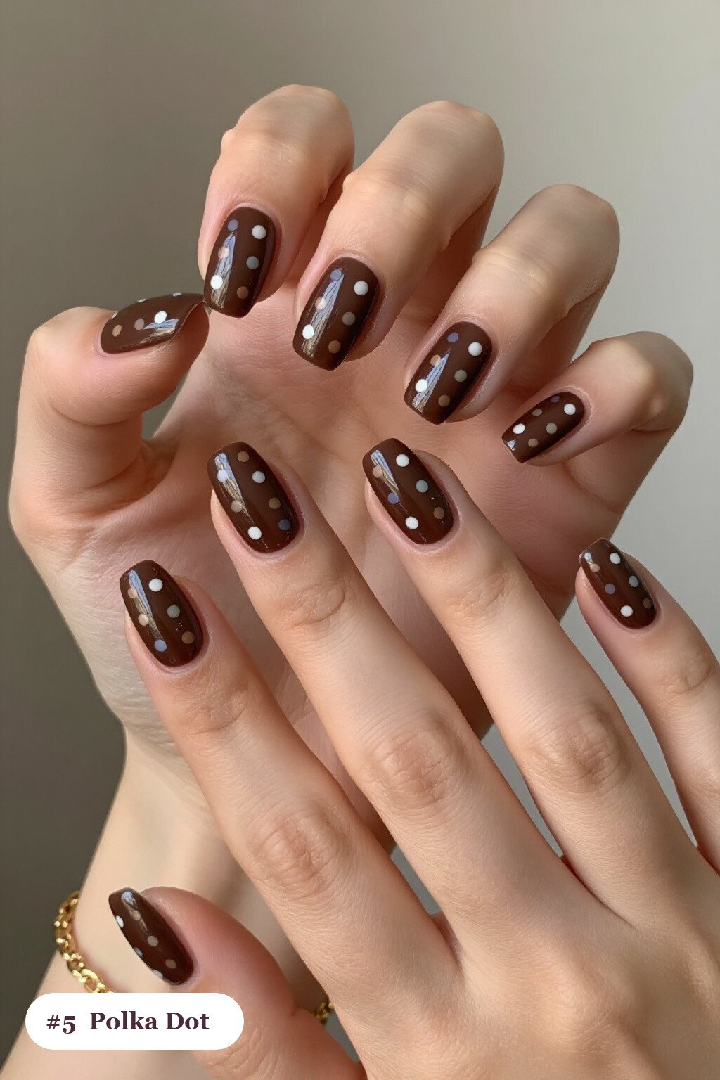 Short almond chocolate brown nails with playful polka dots in two colours on alternating nails, perfect for fall - fall nails short