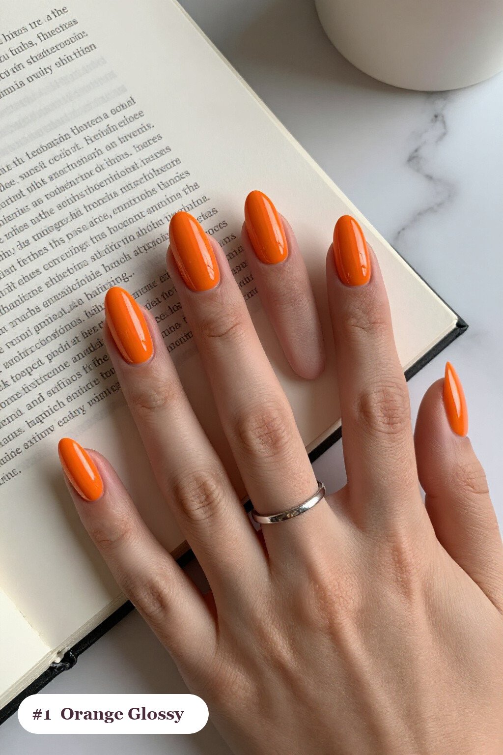 Medium almond orange nails in a flawless mirror-glossy full-colour finish, perfect for halloween - halloween almond nails