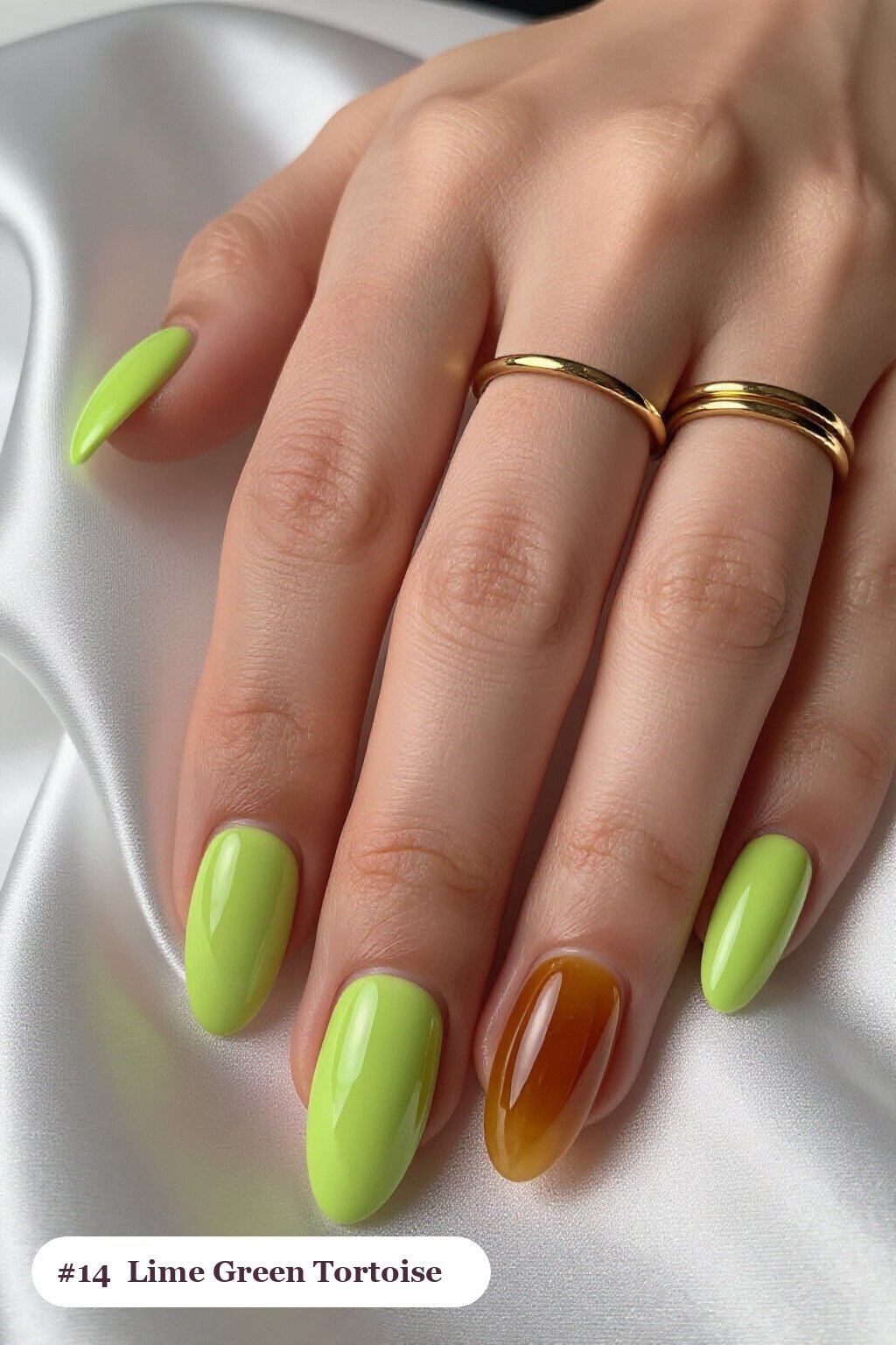 Medium almond lime green nails with glossy amber tortoiseshell on two accent nails, perfect for halloween - halloween almond nails