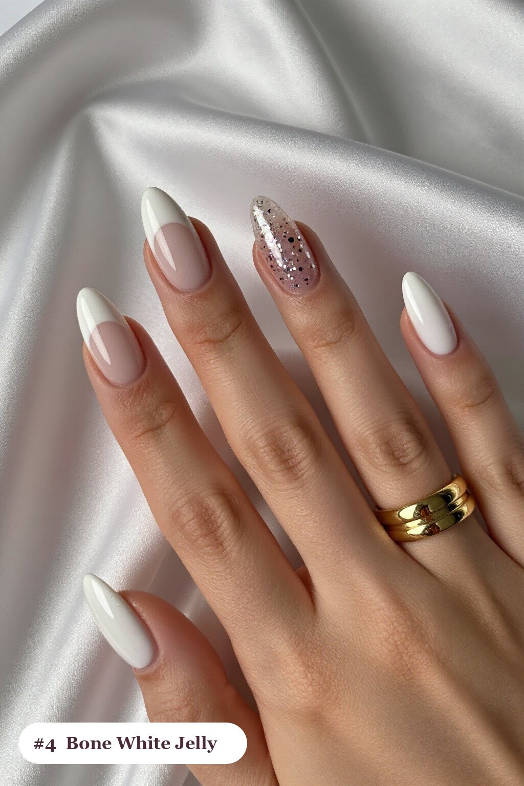 Medium almond bone white nails in a see-through jelly finish with encapsulated glitter, perfect for halloween - halloween almond nails