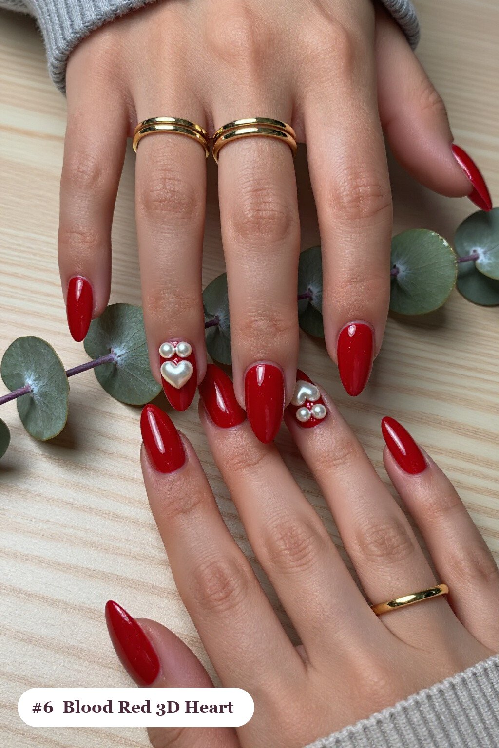 Medium almond blood red nails with chunky 3D gel hearts and pearls on three nails, perfect for halloween - halloween almond nails