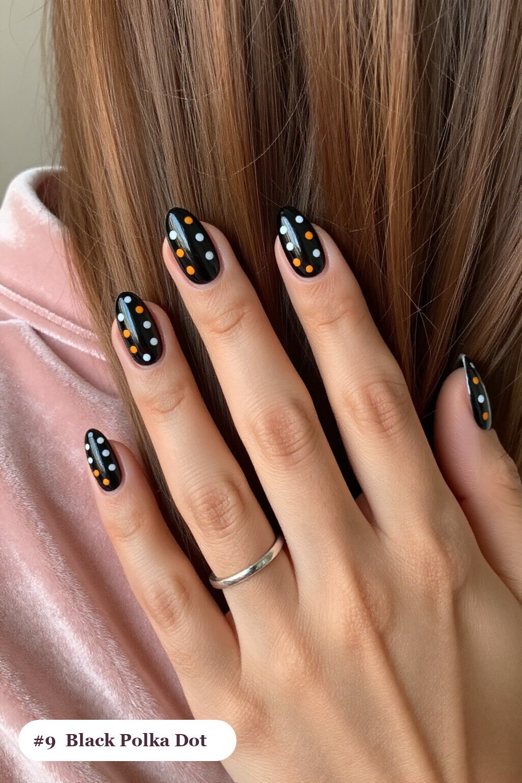 Medium almond black nails with playful polka dots in two colours on alternating nails, perfect for halloween - halloween almond nails