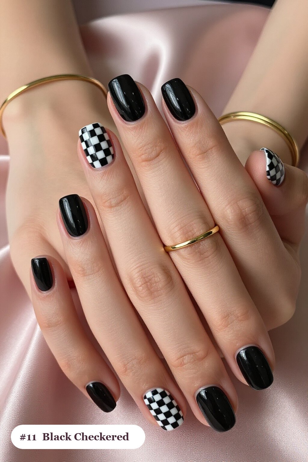Short square black nails with a bold checkerboard pattern on two accent nails and solid colour on the rest, perfect for halloween - halloween nails