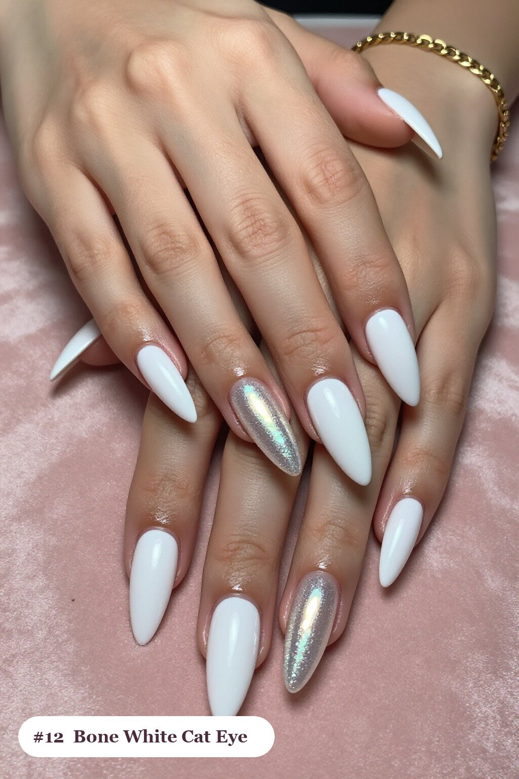 Long stiletto bone white nails with a glowing shimmer band of light running down the centre of each nail like a gemstone, perfect for halloween - halloween nails