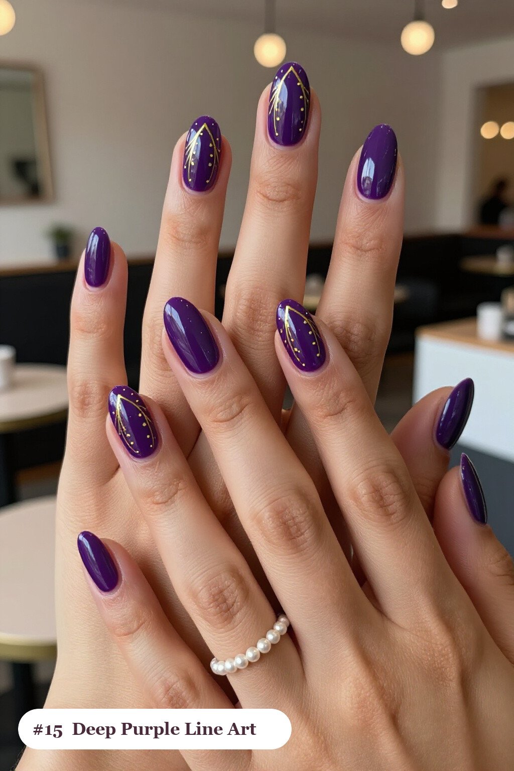 Medium oval deep purple nails with fine gold line art and tiny dots drawn across every nail, perfect for halloween - halloween nails