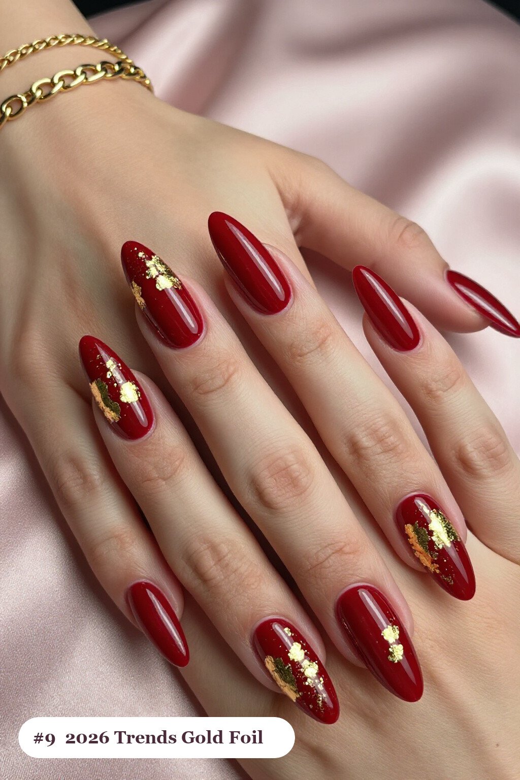 Blood‑Red Ballerina Nails Covered in Dense Gold Foil Flakes - halloween nails 2026 trends