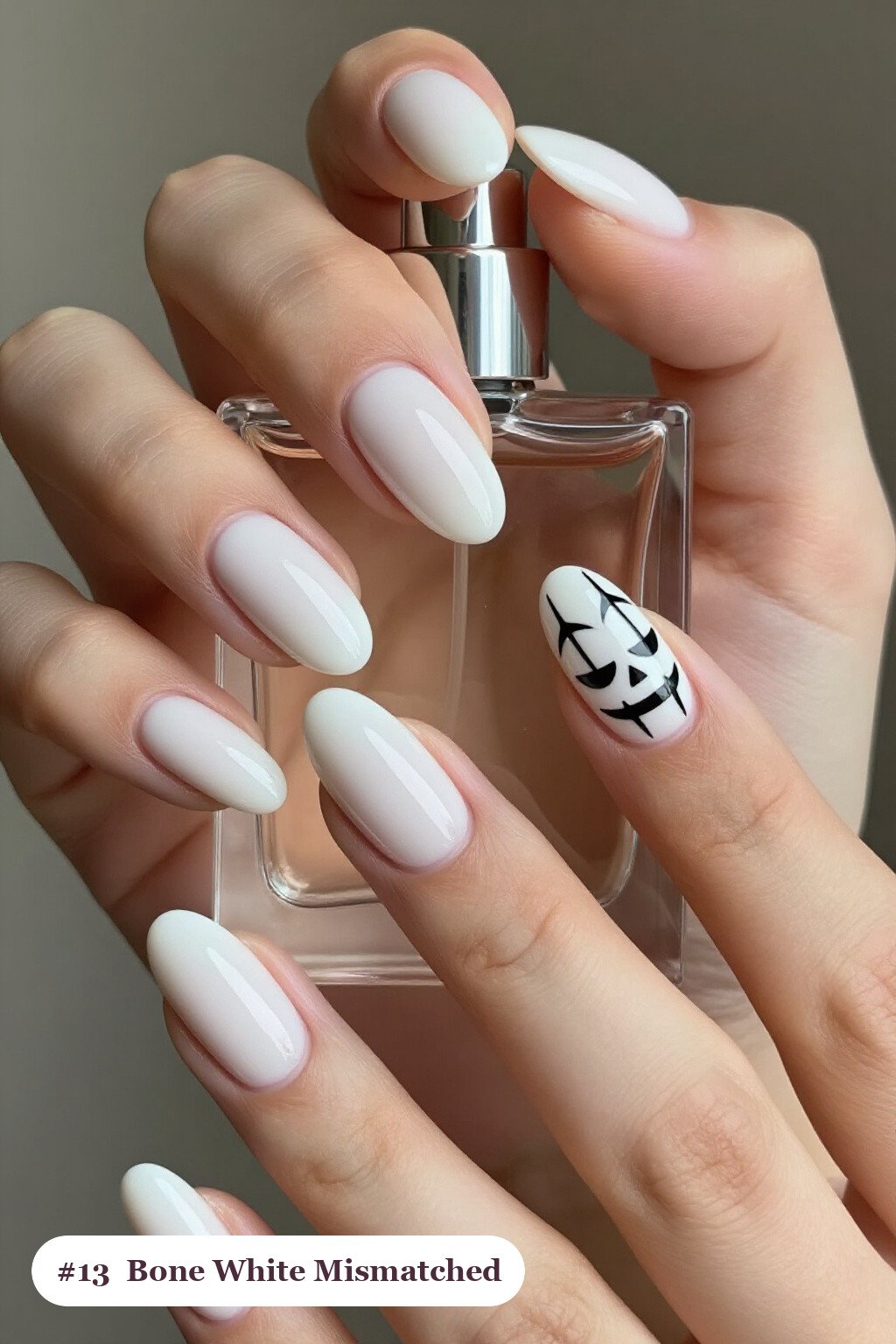 Medium Almond Bone White Mismatched Set with Unified Colour Story - halloween nails designs