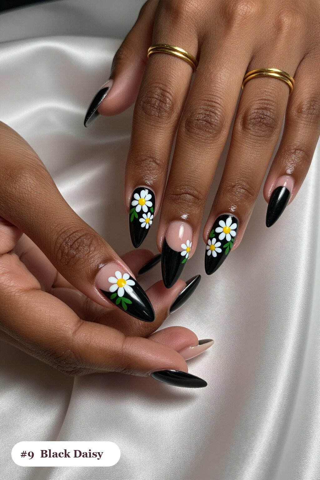 Long Stiletto Black Nails Hand‑Painted with Daisies and Green Leaves - halloween nails designs