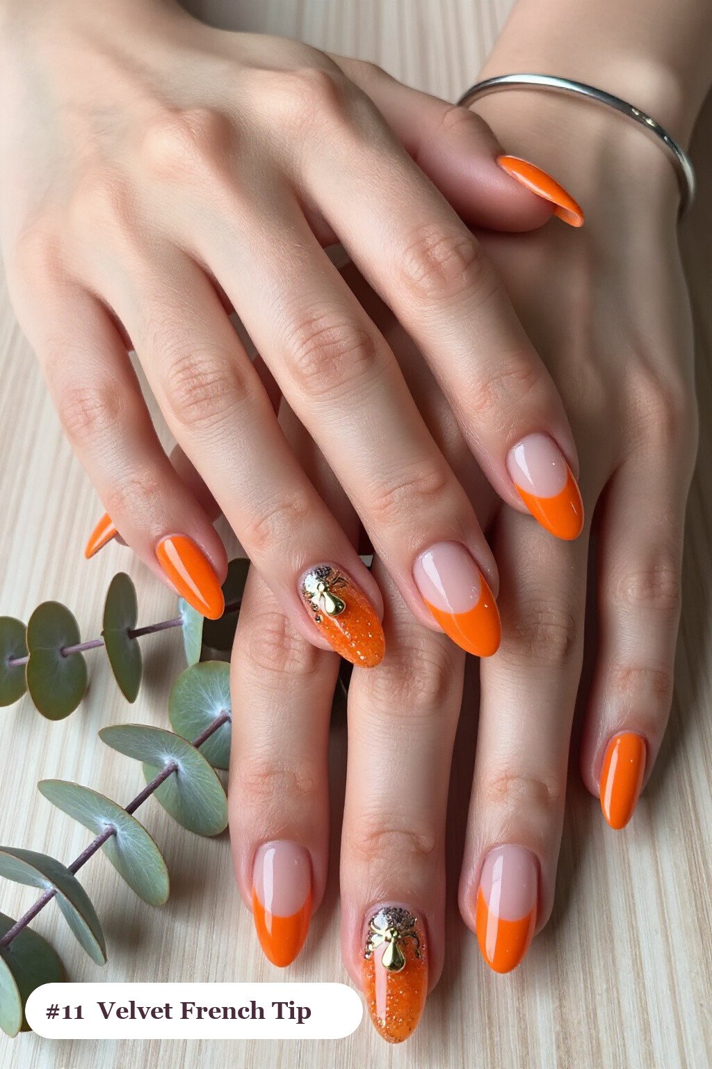 Halloween Nails French Tip: Medium Almond Orange with Velvet Shimmer and Gold Charm - halloween nails french tip