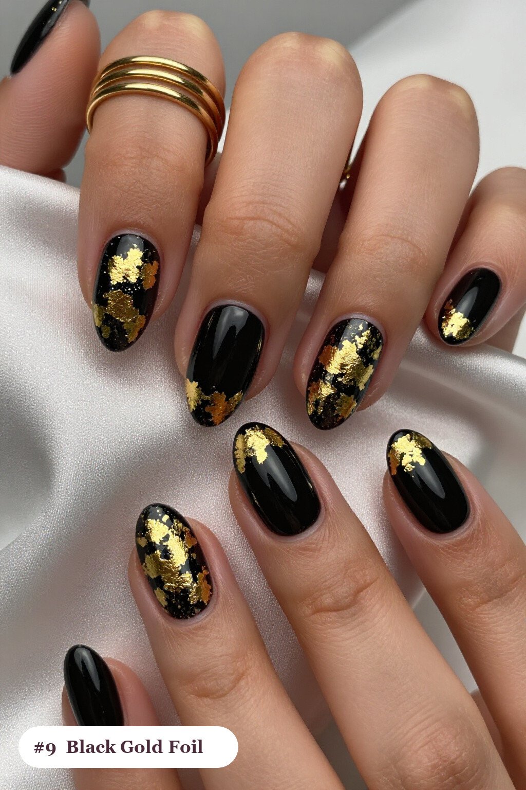 Black Almond Nails Covered in Dense Gold Foil Flakes and Leaf - halloween nails short