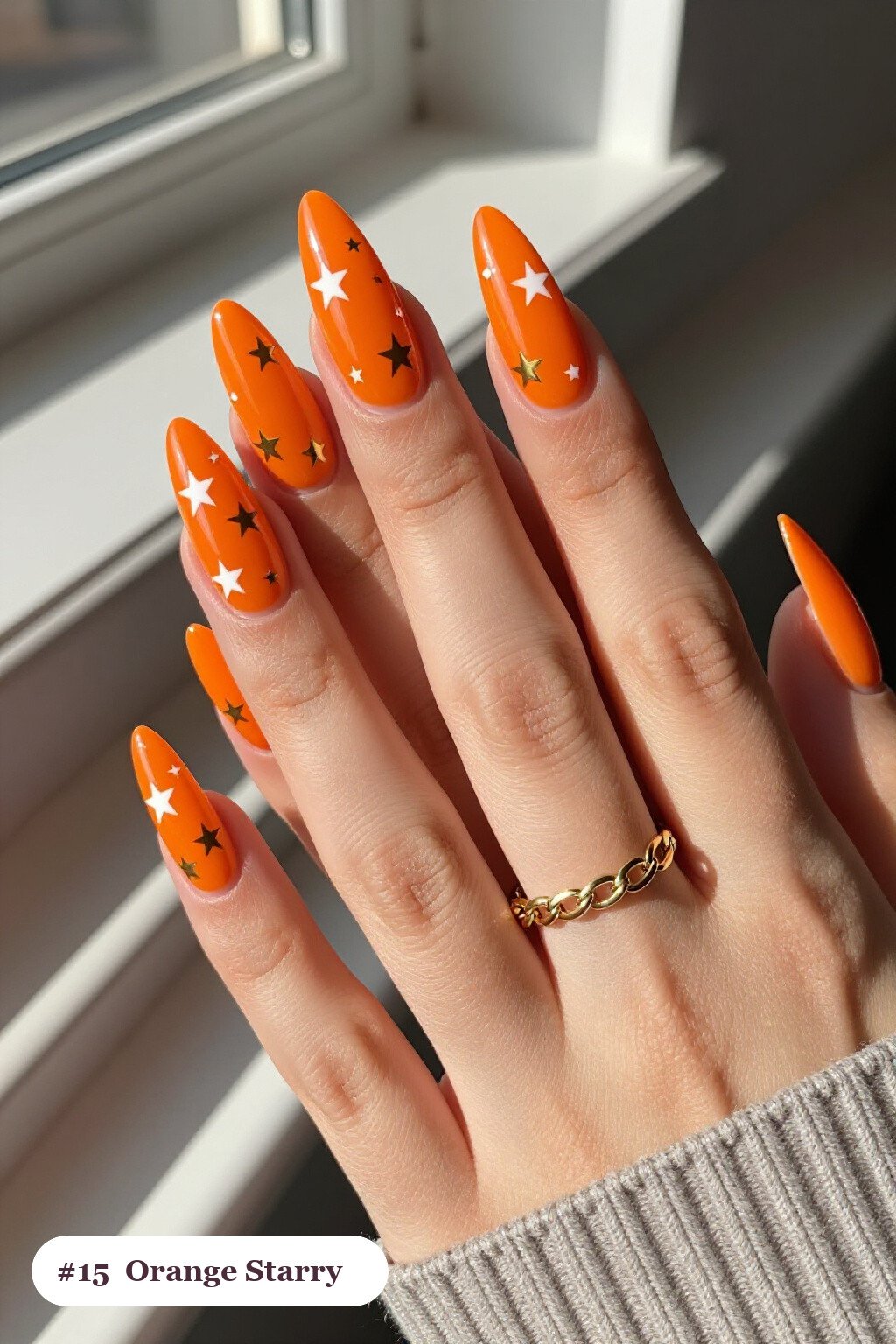 Long Stiletto Orange Nails Decorated with White and Gold Stars and Sparkles - halloween nails simple Long Stiletto Orange Nails Decorated with White and Gold Stars and Sparkles - halloween nails simple