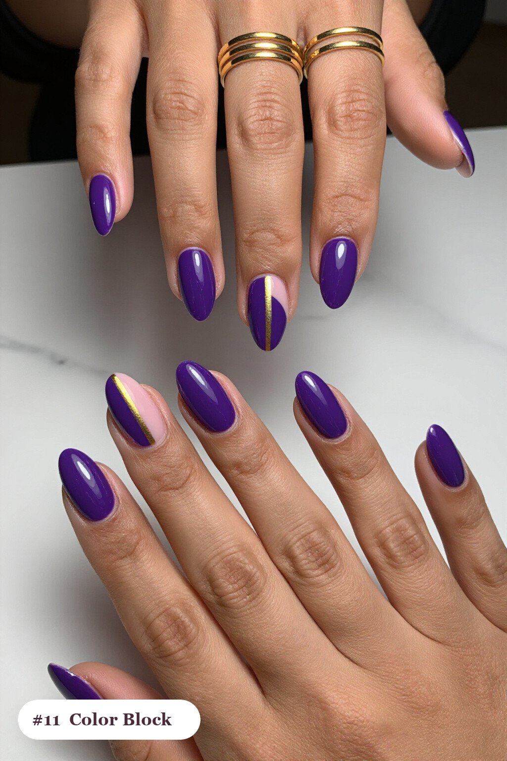 Medium coffin deep purple charms nails in a colour-block design split diagonally with a thin gold line, perfect for halloween - halloween nails with charms