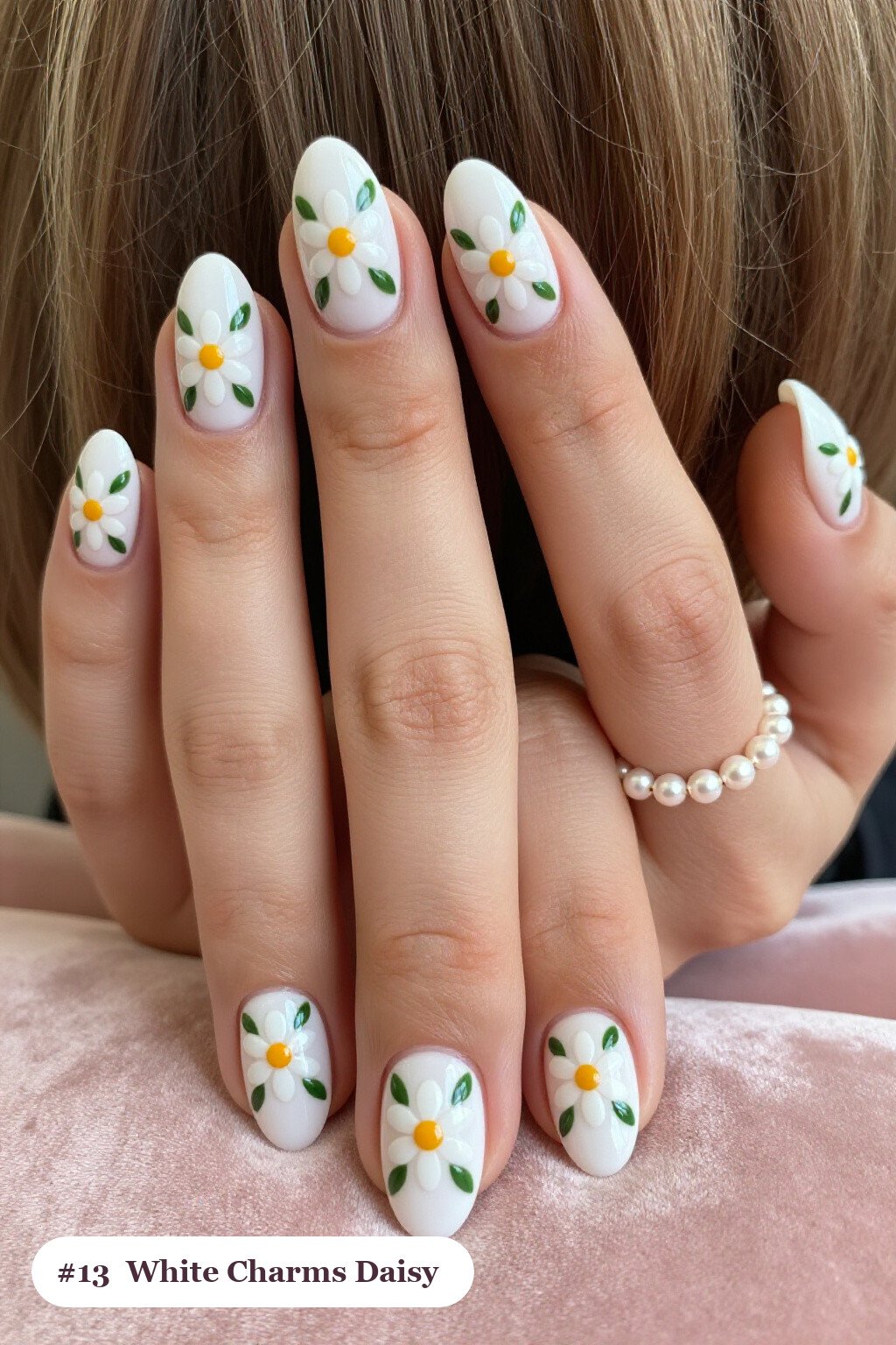 Medium oval bone white charms nails with hand-painted daisies and green leaves across every nail, perfect for halloween - halloween nails with charms